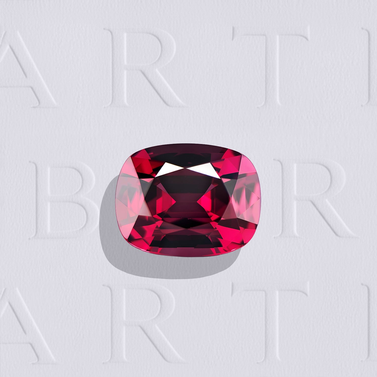 Grenat rhodolite naturel coussin rectangle facetté de 2.52 carats, originaire de Tanzanie, de couleur rose-rouge profonde, sans inclusion visible à la loupe 10x et non traité.