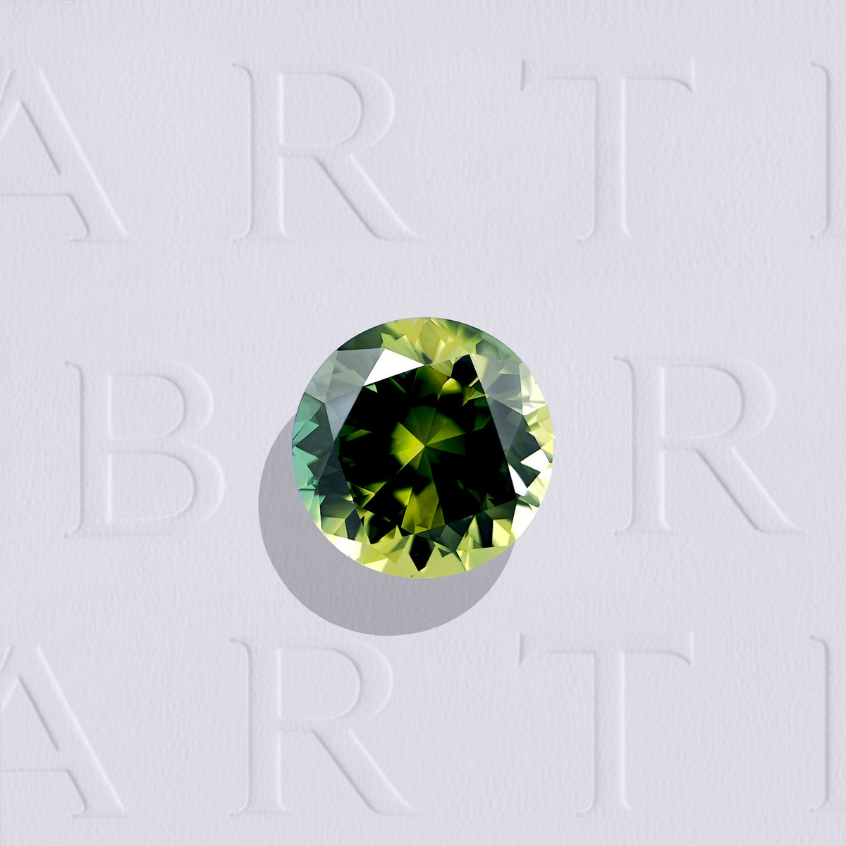 Saphir bicolore naturel rond facetté de 1.53 carat, originaire d’Australie, présentant des couleurs bleu-vert et jaune, sans inclusion visible à l’œil nu et non traité.