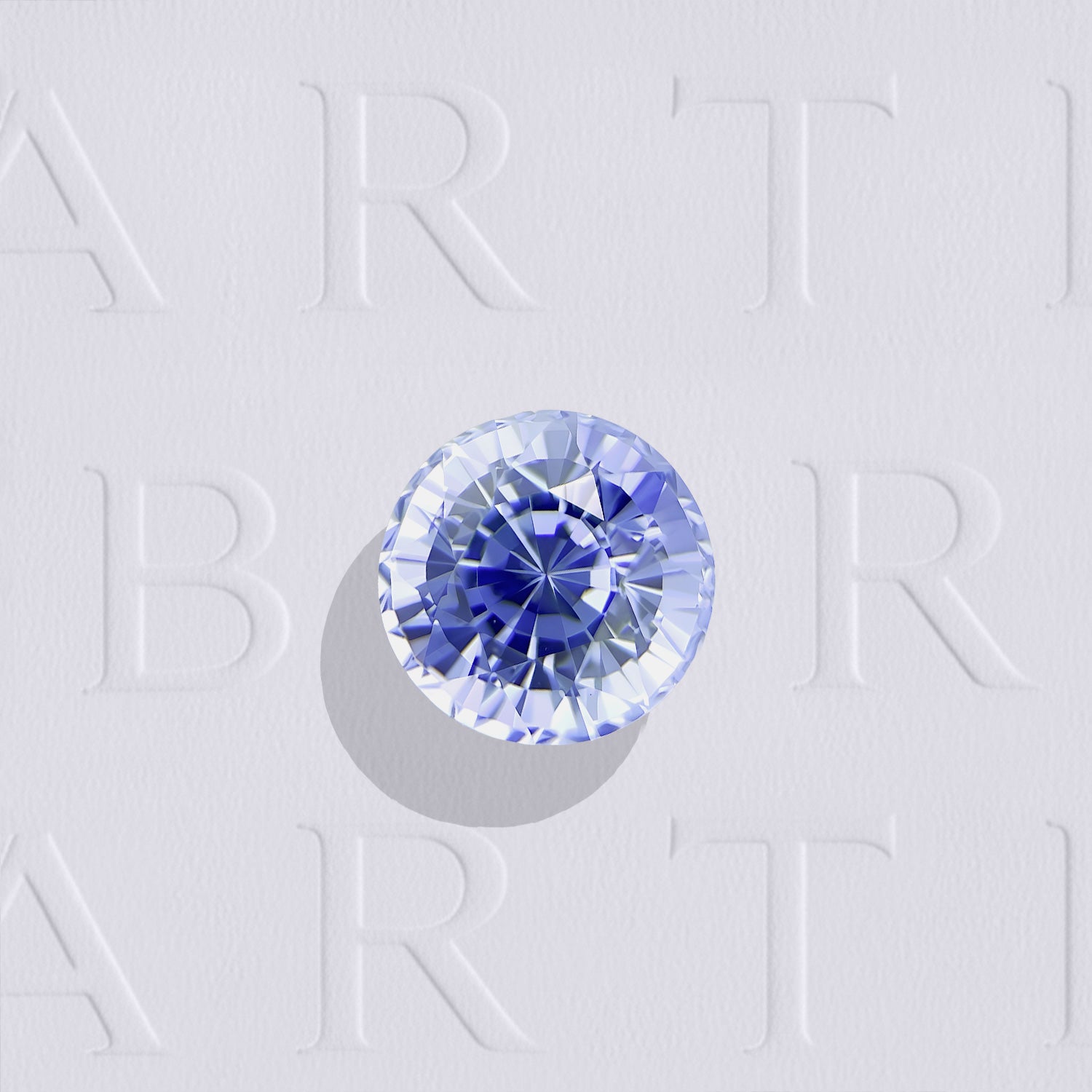 Saphir bleu naturel rond facetté de 1.24 carat, originaire du Sri Lanka, de couleur bleu léger, très légèrement inclus et non traité.