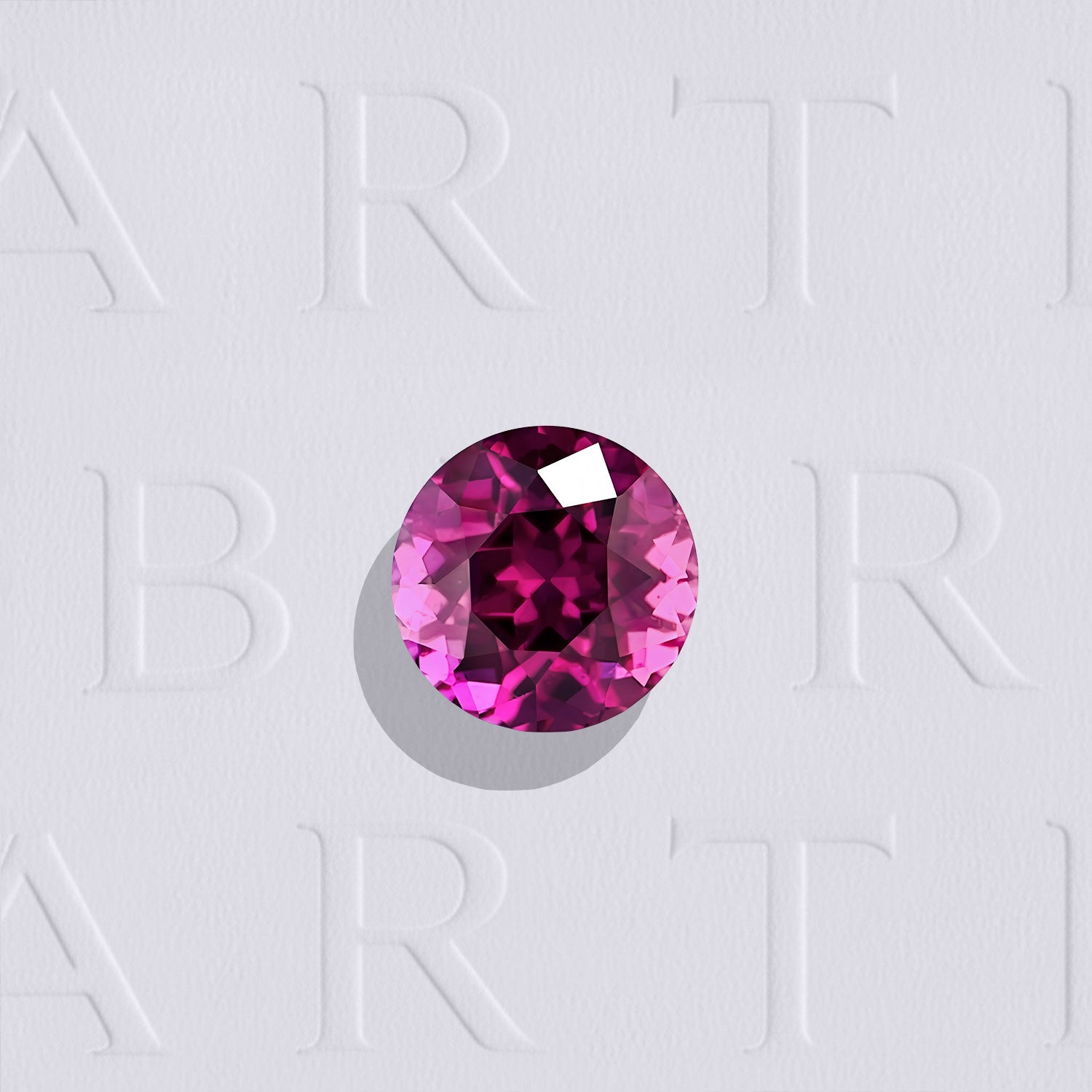 Saphir rose naturel rond facetté de 0.47 carat, originaire de Madagascar, de couleur rose-rouge profond, légèrement inclus et non traité.