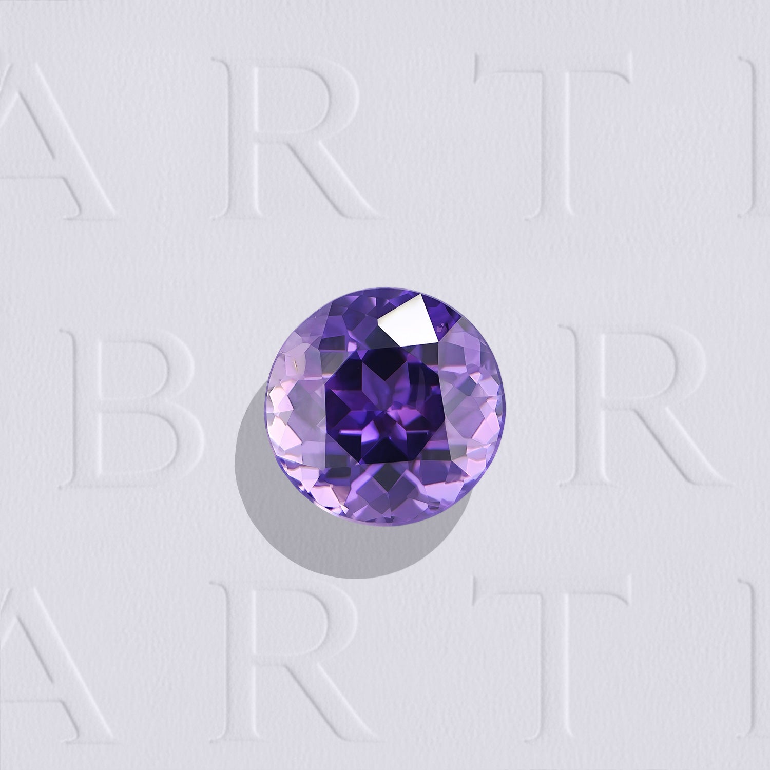 Saphir violet naturel rond facetté de 1.00 carat, originaire du Sri Lanka, de couleur violet profond, très légèrement inclus, non traité.