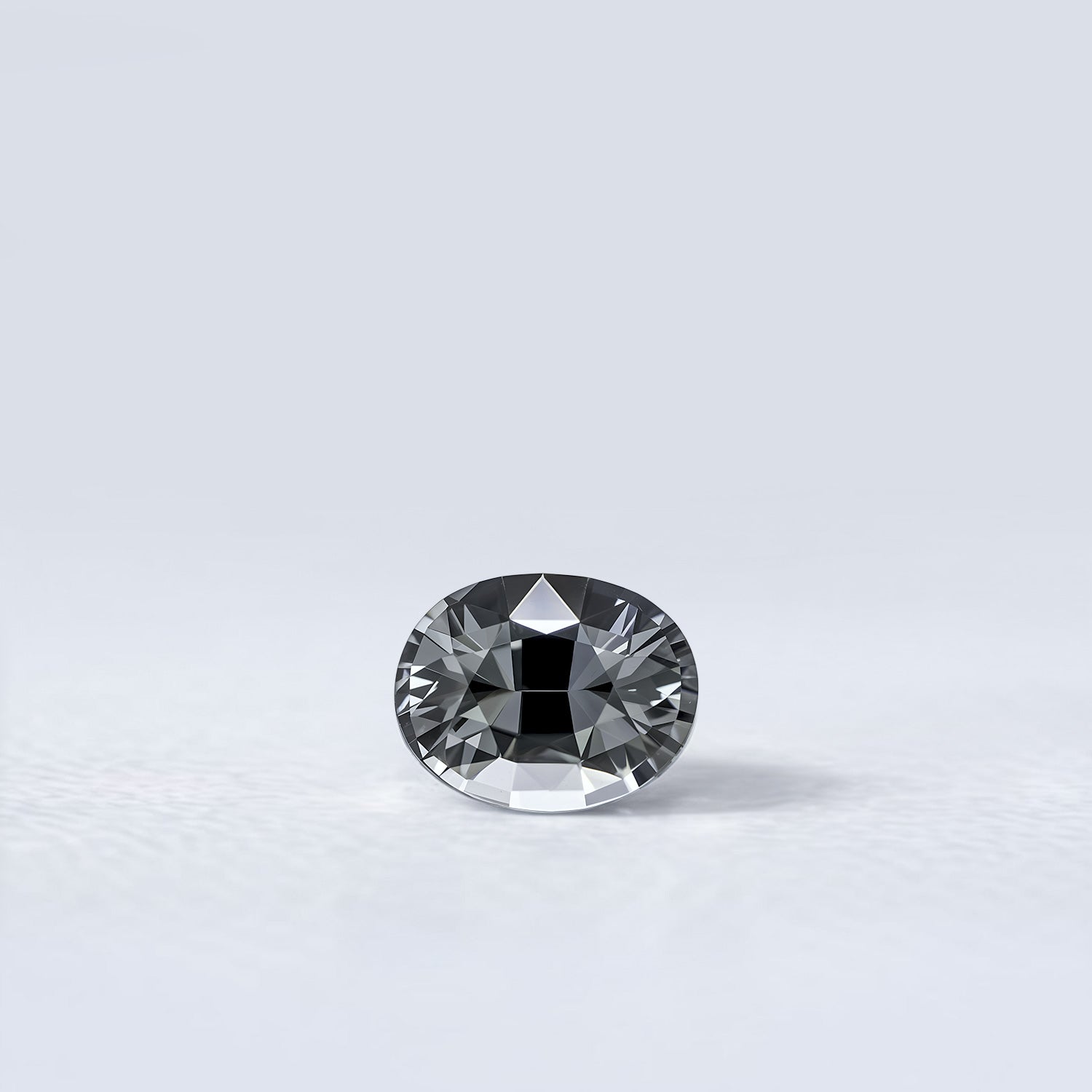 Spinelle naturel ovale facetté de 1.08 carat, couleur grise soutenue, originaire du Myanmar