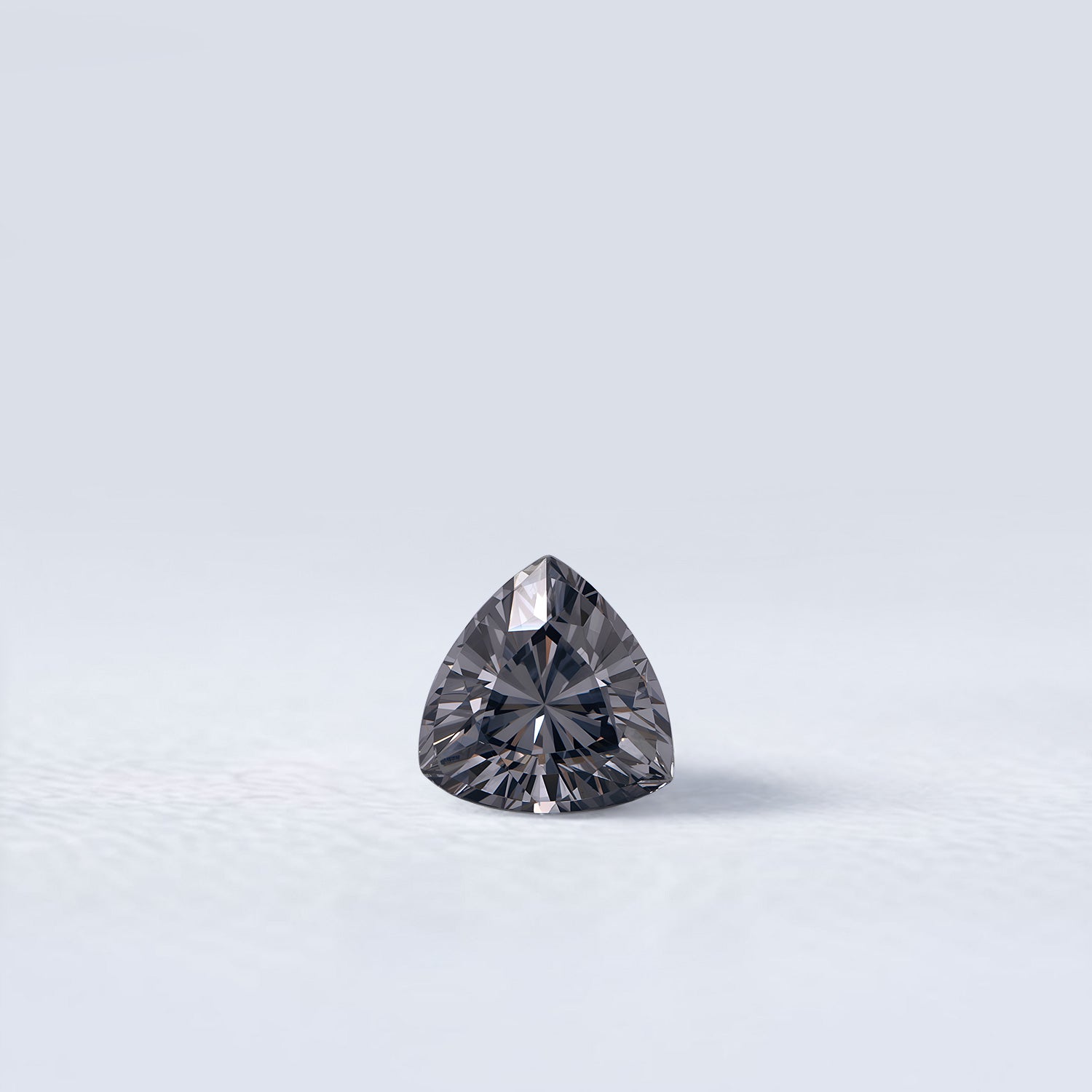 Spinelle gris naturel trillion facetté de 1.05 carat, couleur gris soutenu, originaire du Myanmar