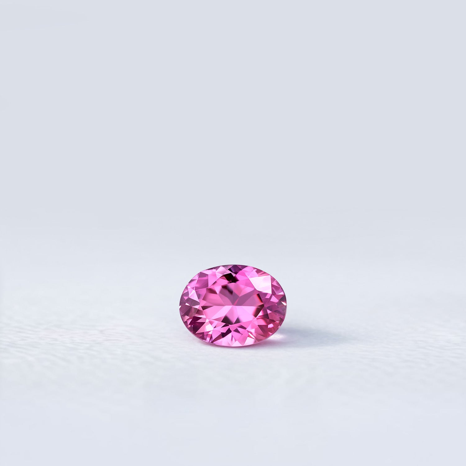 Spinelle naturel ovale de 0.64 carat, facetté, de couleur rose soutenu, originaire de Tanzanie