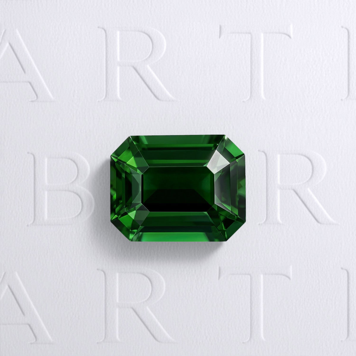 Tourmaline chrome verte naturelle rectangle à pans coupés facettée de 2.85 carats, originaire de Tanzanie, de couleur vert profond et sans inclusion à la loupe 10x. Gemme certifiée non traitée.