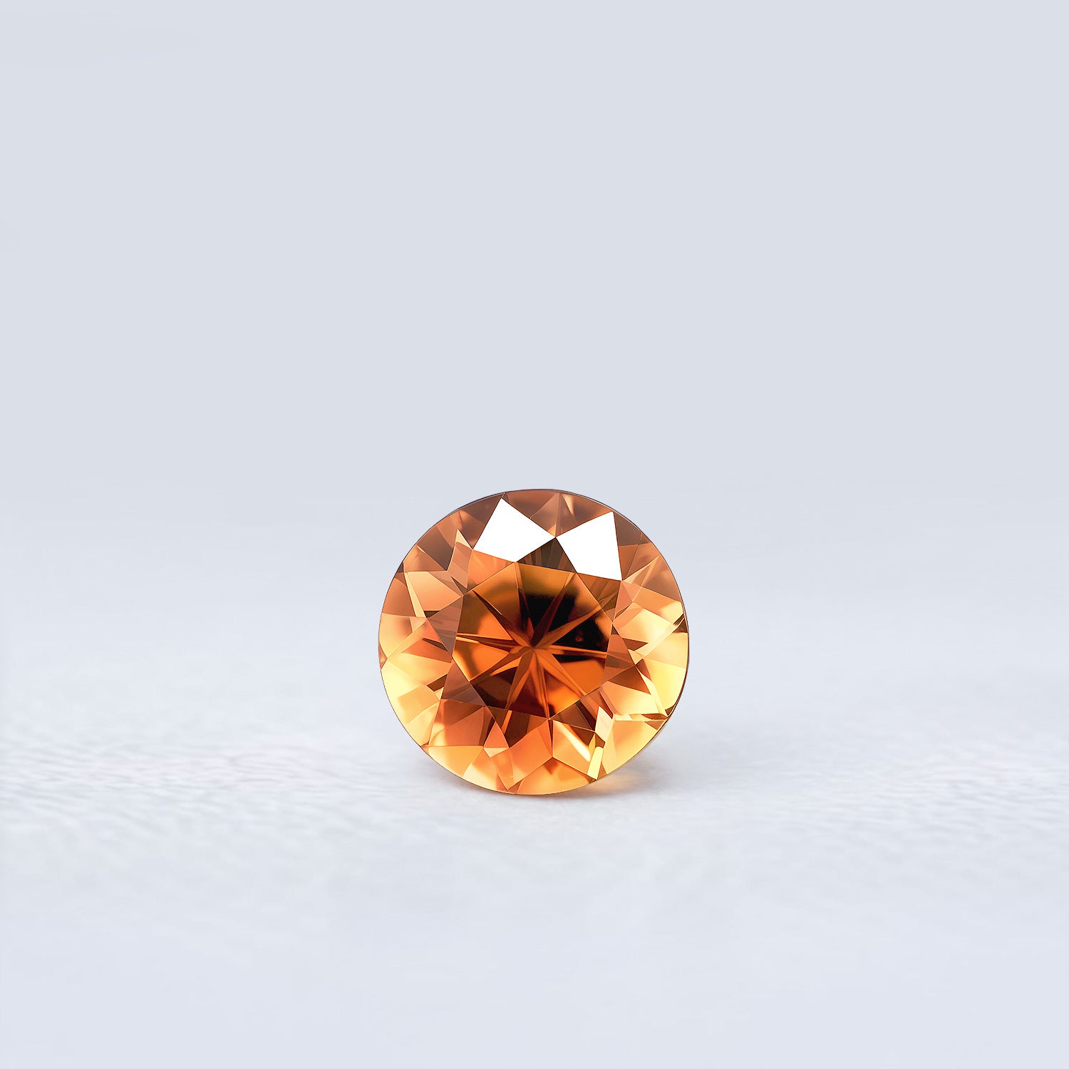 Tourmaline orange-jaune 3,16 carats, taille ronde facettée, couleur intense, origine Madagascar