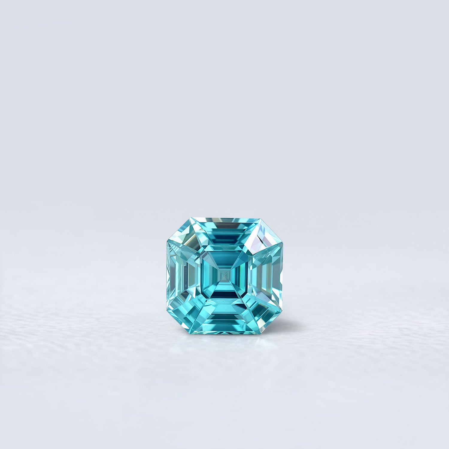 Zircon bleu cyan naturel de 2.99 carats facetté en carré à pans coupés, gemme naturelle du Cambodge.