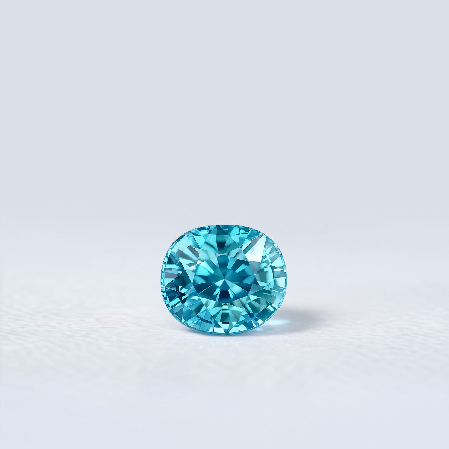 Zircon bleu naturel ovale de 2.68 carats, facetté, cyan bleuté soutenu, sans inclusion visible à la loupe 10x.