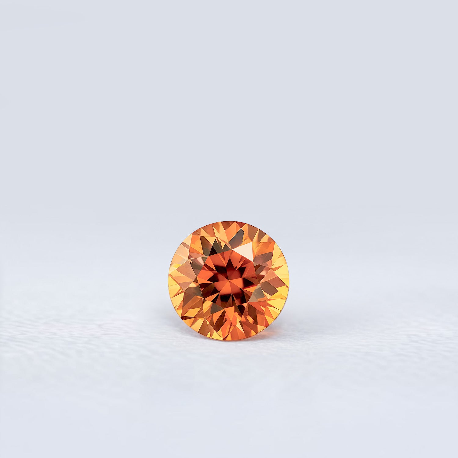 Zircon orange rond facetté 1,84ct, couleur orange-brun soutenu, excellente qualité, origine Tanzanie
