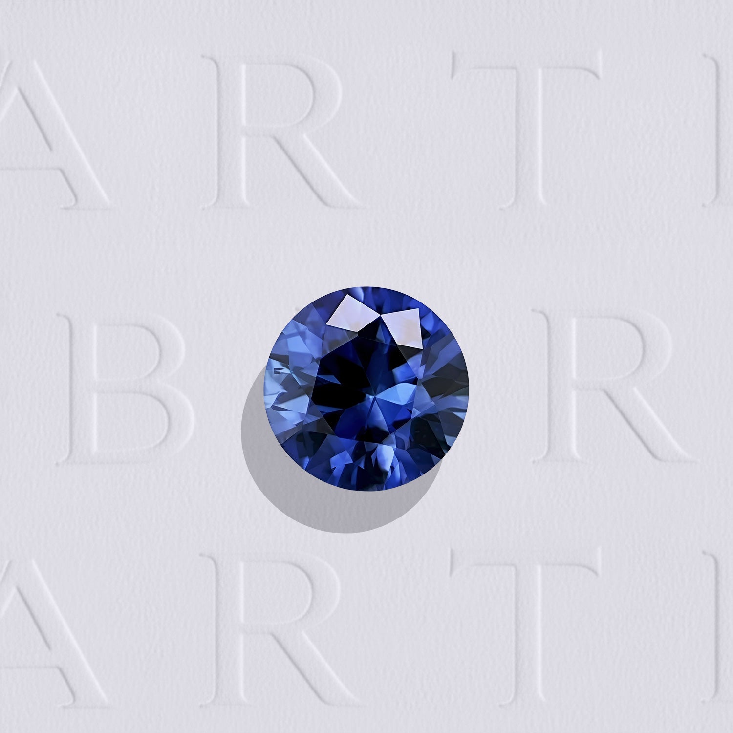 Saphir bleu naturel rond facetté de 0.19 carat, originaire du Sri Lanka, de couleur bleu soutenu, légèrement inclus et chauffé.