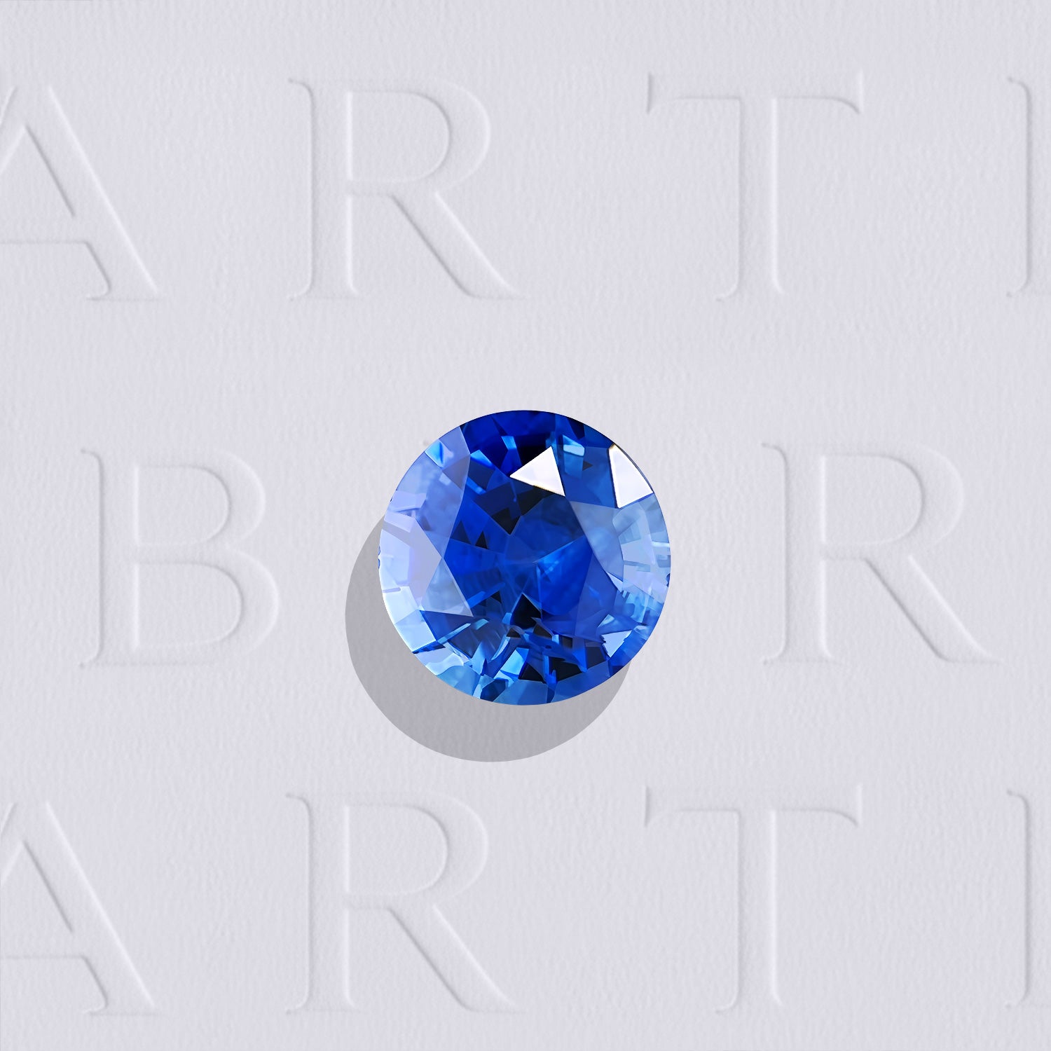 Saphir bleu naturel rond facetté de 0.32 carat, originaire du Sri Lanka, de couleur bleu intense, légèrement inclus et chauffé.