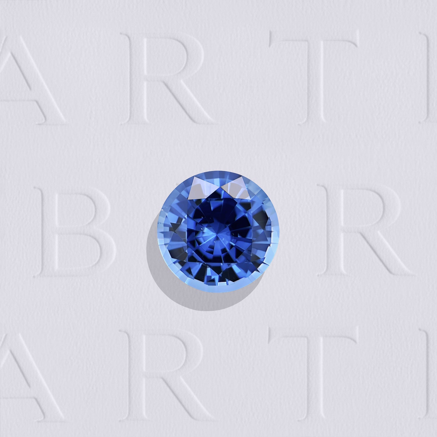 Saphir bleu naturel non chauffé rond facetté de 0.66 carat, originaire du Sri Lanka, de couleur bleu soutenu, très légèrement inclus.