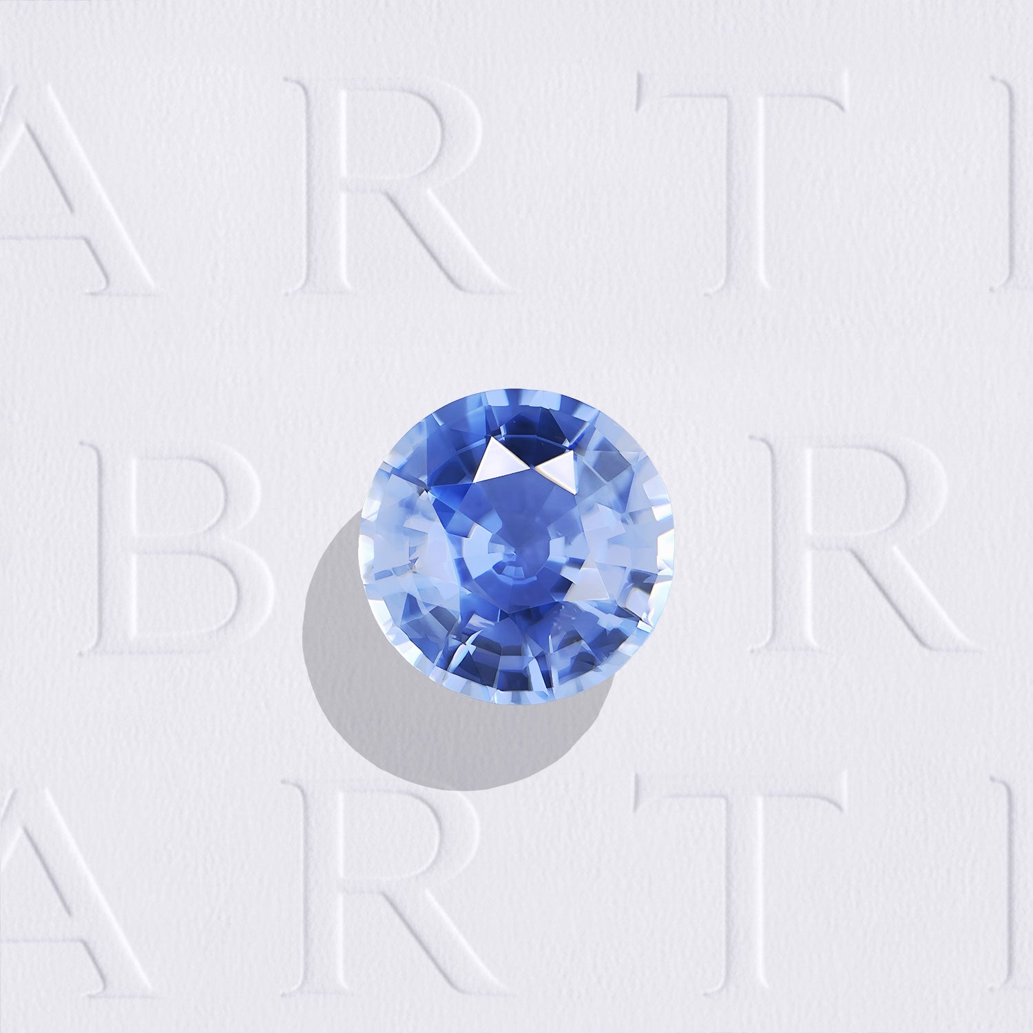 Saphir bleu naturel rond facetté de 0.96 carat, originaire du Sri Lanka, de couleur bleu prononcé, inclus et non traité.