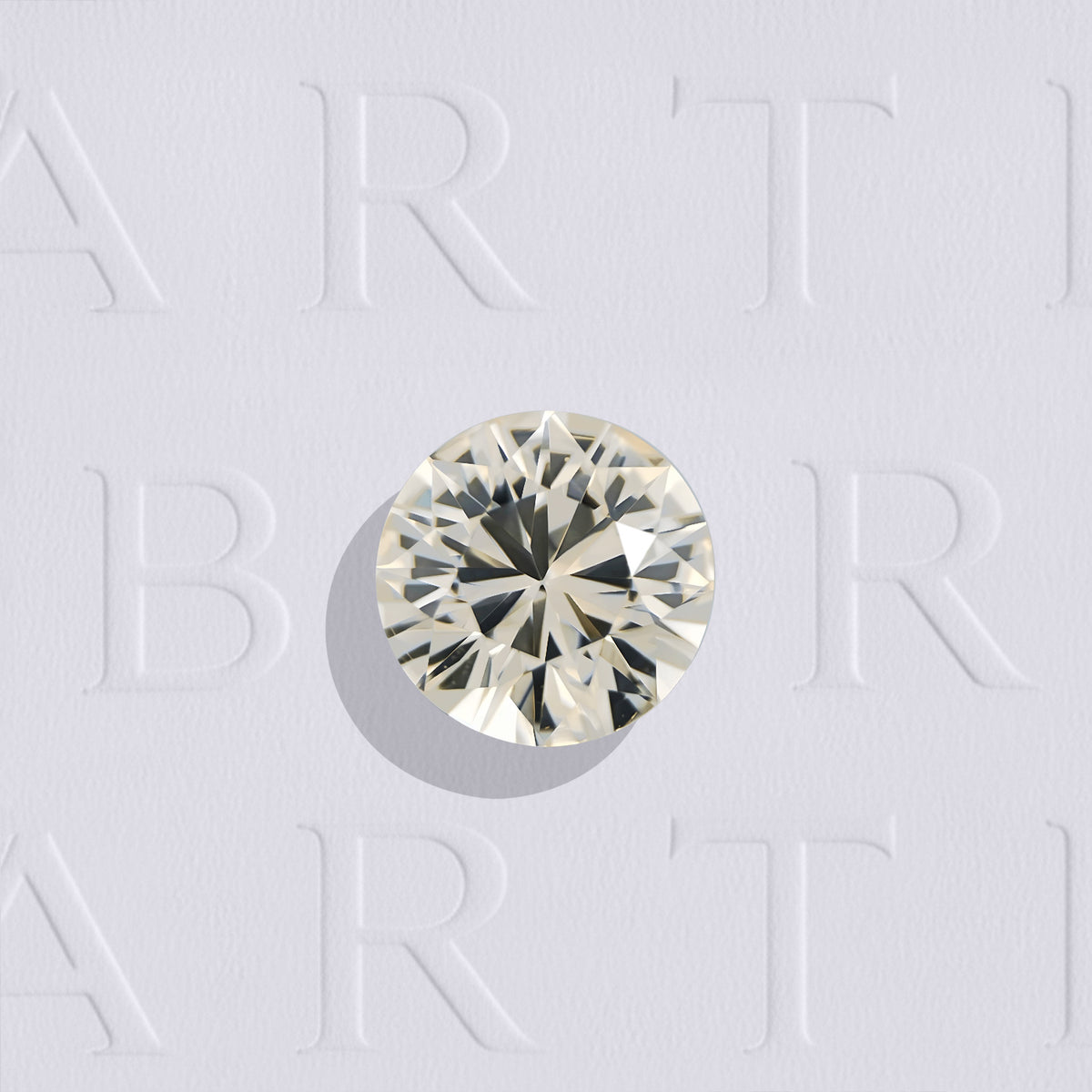 Saphir jaune naturel rond facetté de 1.23 carat, originaire du Sri Lanka, de couleur jaune orangé très léger, très légèrement inclus. Aucun traitement.