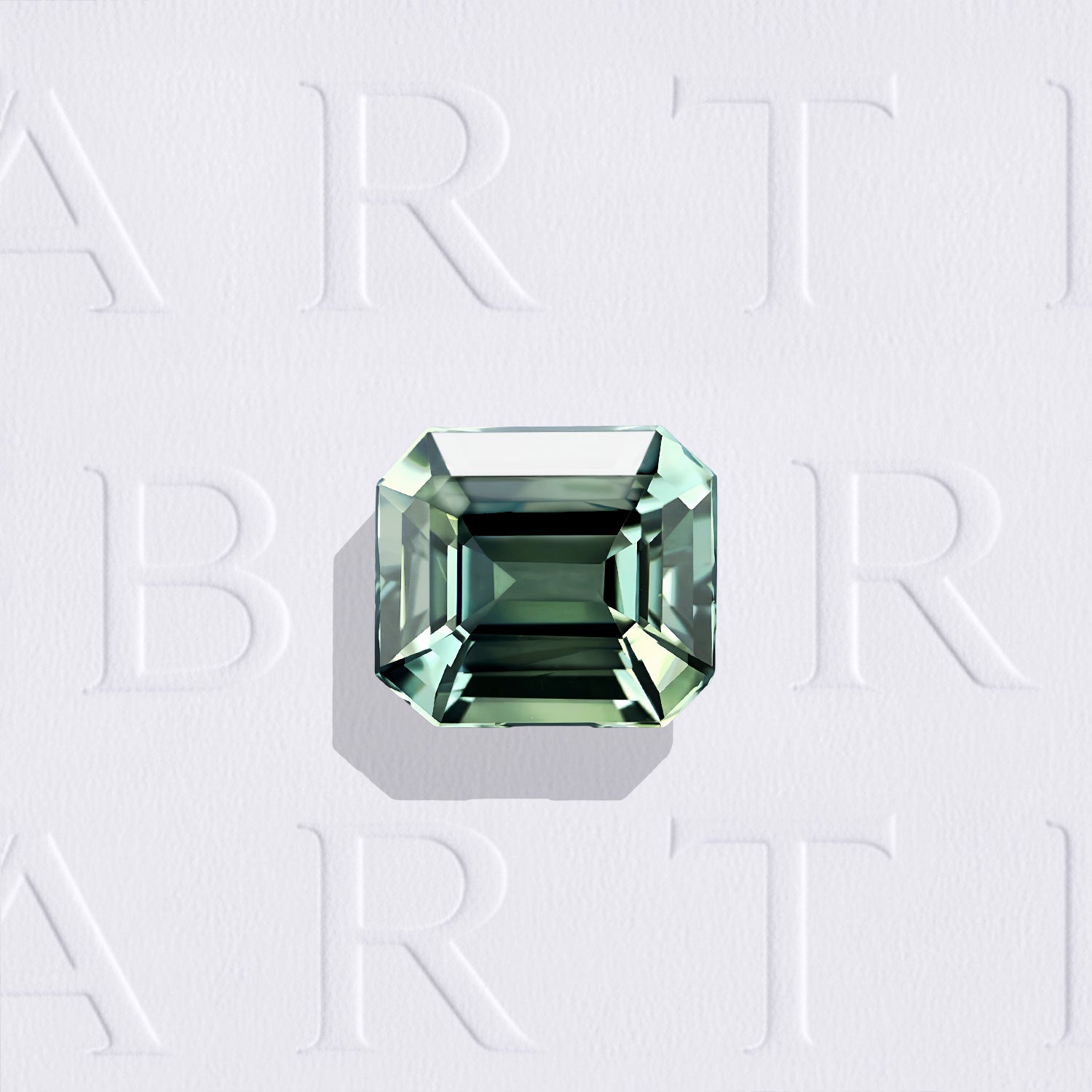 Saphir teal naturel rectangle à pans coupés facetté de 1.19 carat, originaire de Tanzanie, de couleur bleu-vert prononcé et sans inclusion à la loupe 10x.
