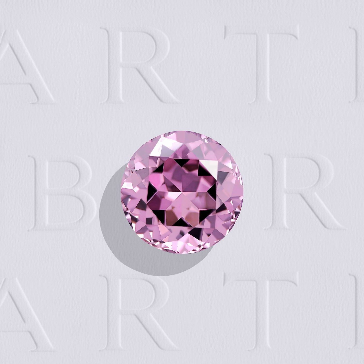 Spinelle rose naturel rond facetté de 1.74 carat, originaire de Tanzanie, de couleur rose-violet prononcé, sans inclusion visible à l'œil nu et non traité.