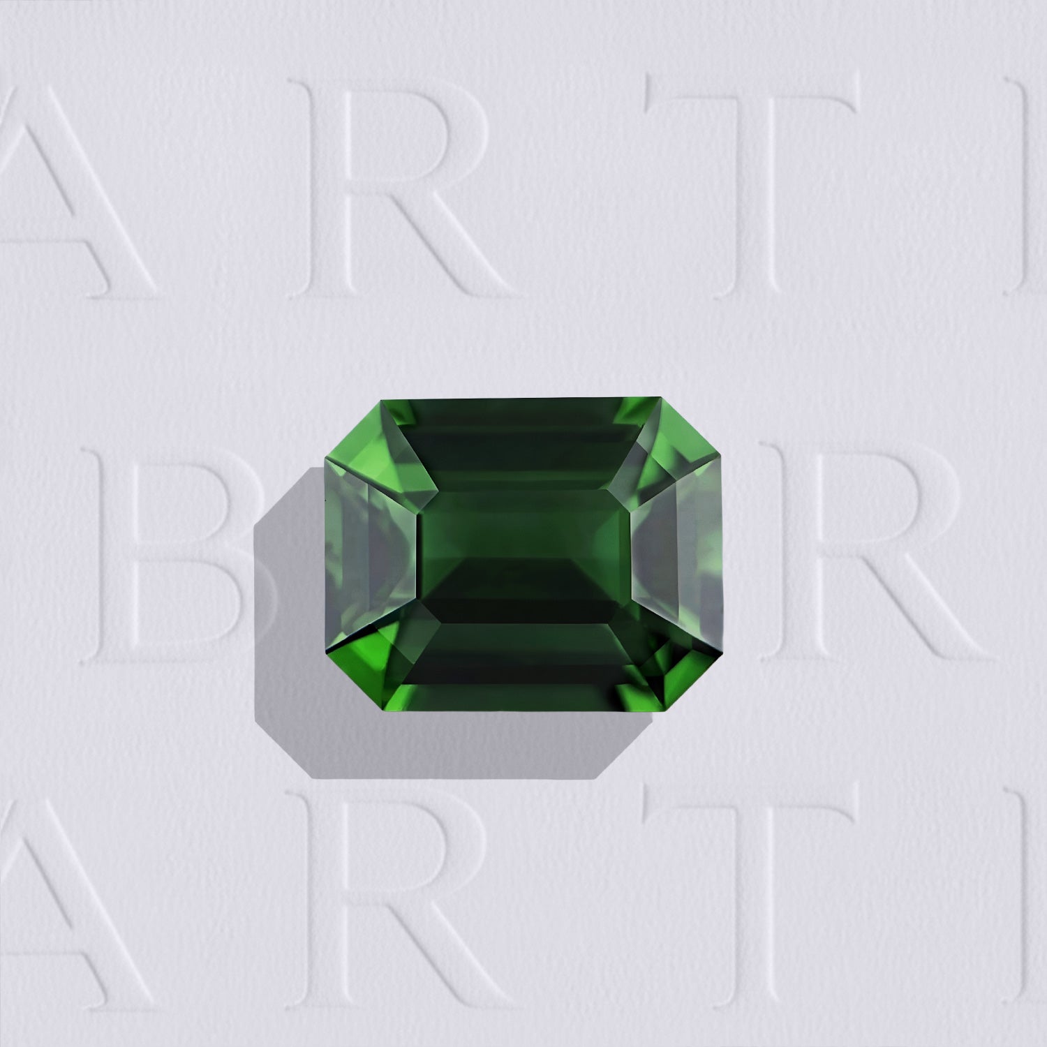 Tourmaline chrome verte naturelle rectangle à pans coupés facettée de 2.85 carats, originaire de Tanzanie, de couleur vert profond et sans inclusion à la loupe 10x. Gemme certifiée non traitée.