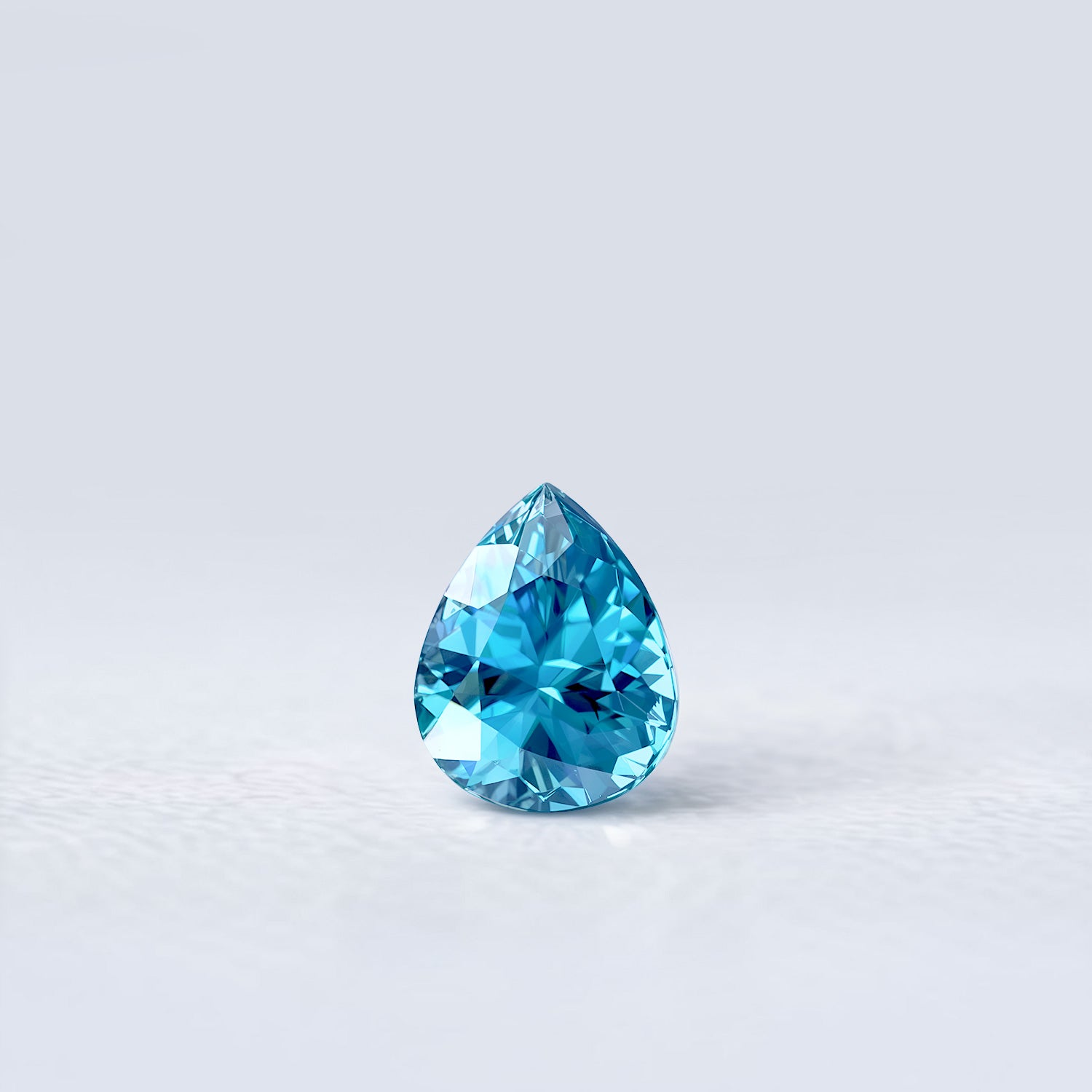 Zircon bleu naturel en forme de poire de 1.89 carat facetté, couleur cyan soutenu, origine Cambodge