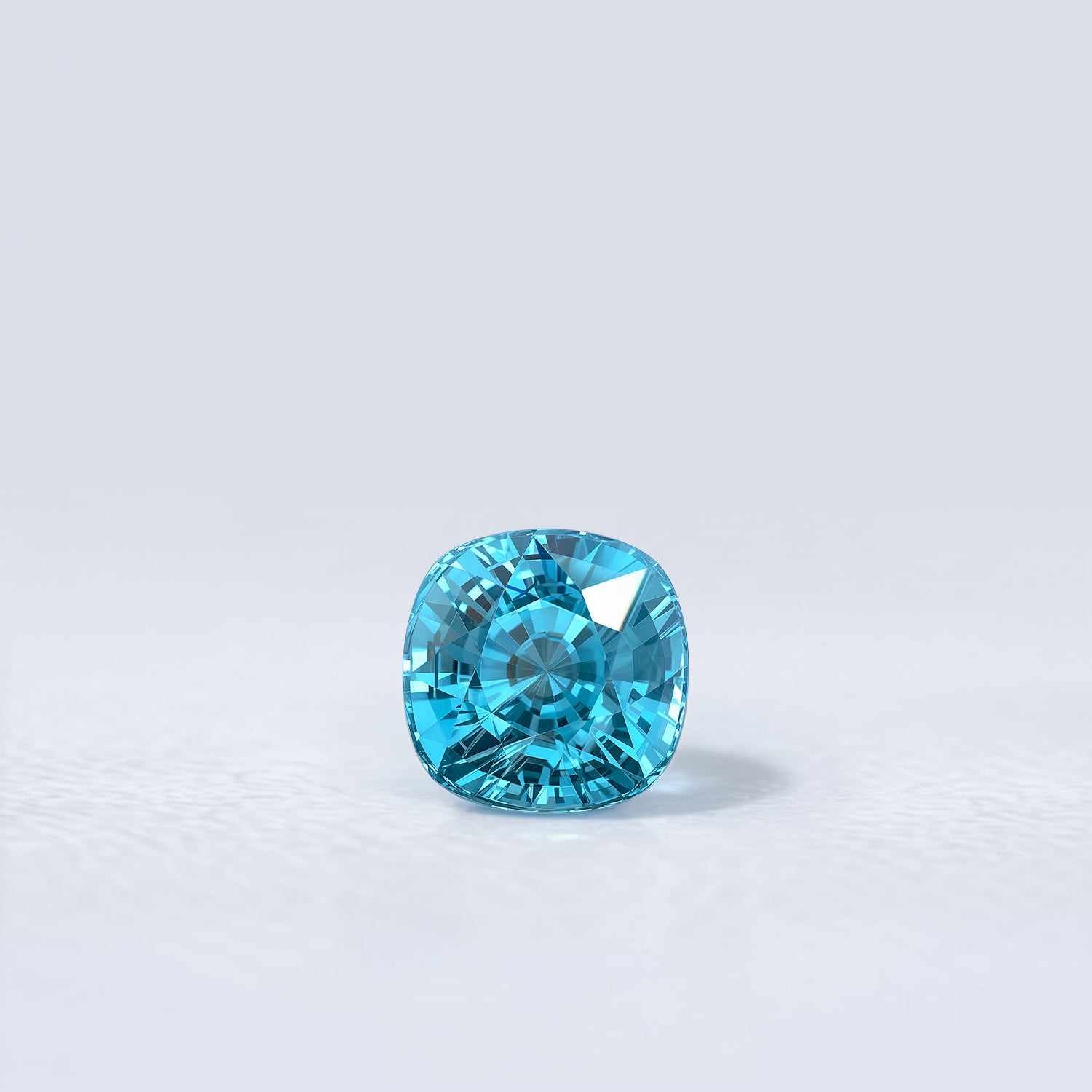 Zircon bleu naturel coussin carré de 2.77 carats, facetté, cyan bleuté soutenu, sans inclusion visible à l’œil nu.